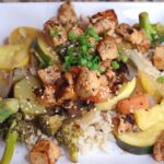 White plate with Asian tofu stir fry