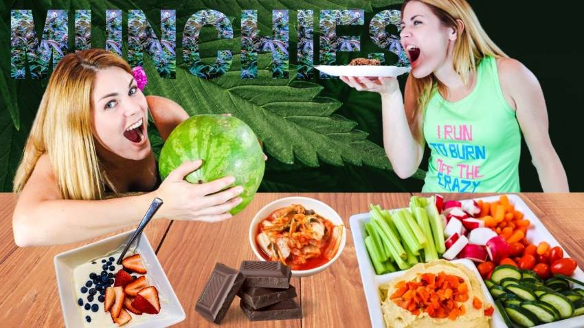 Caitlin Havener holding watermelon. Couple of white bowls filled with strawberries, blackberries,radishes,cucumbers,cherry tomatoes.