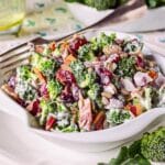 nice white bowl filled with broccoli and other vegetables overflowed with greek yogurt