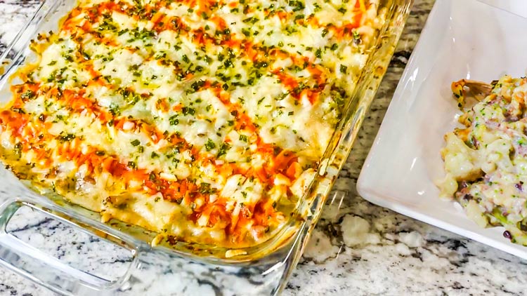 buffalo chicken casserole served in a glass baking pot