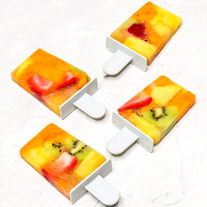 homemade electrolyte popsicles with tropical fruits