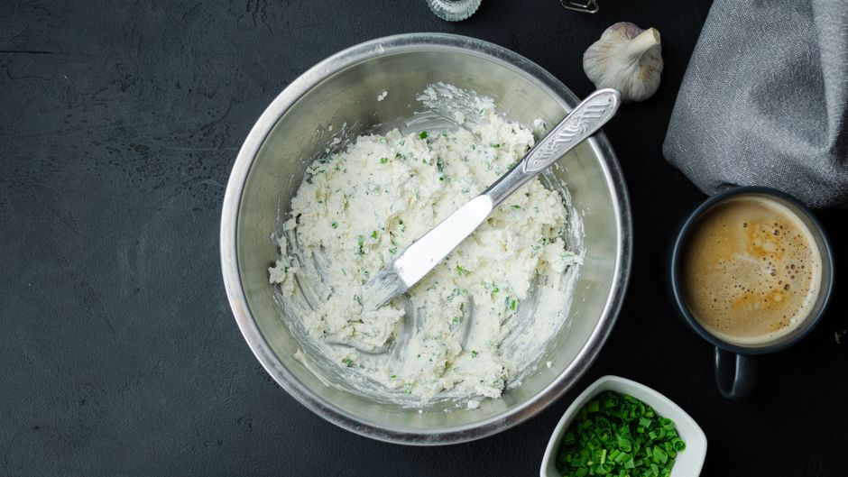 Turning roasted garlic into a spreadable paste (Image Credits: Pexels)